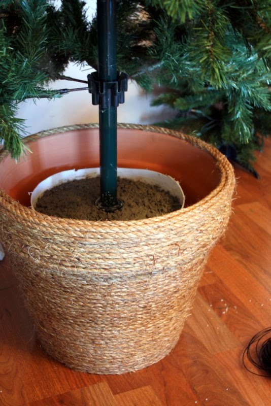 An earthen vase as a tree stand